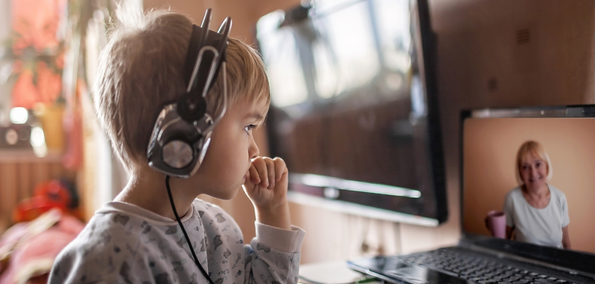 Student learning online with headphones